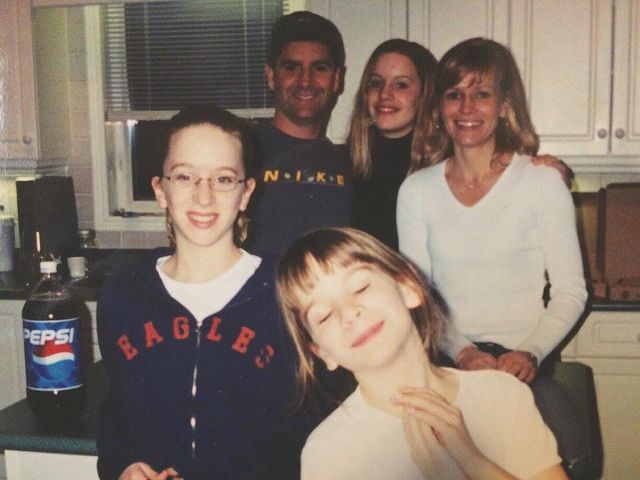 Picture of Brooke Palsson with her family wearing white color dress